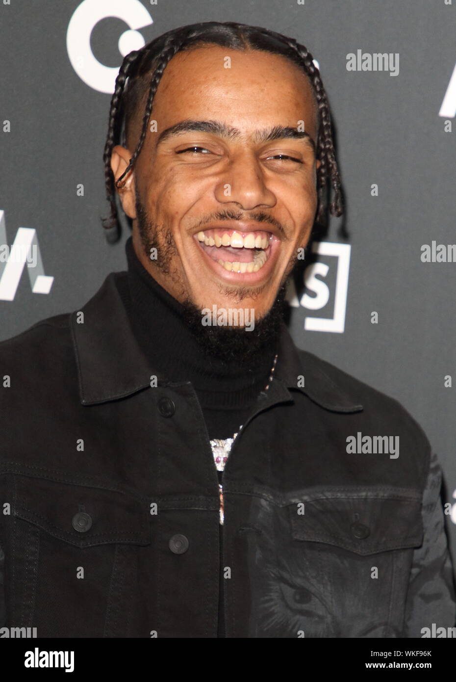 Rapper AJ Tracey on the red carpet arrivals board during the AIM Independent Music Awards 2019 held at the Roundhouse in London. Stock Photo