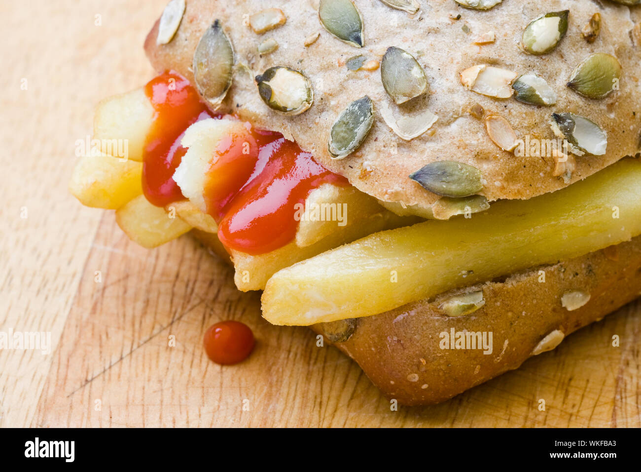 chips-in-a-wholemeal-bread-bun-with-ketchup-stock-photo-alamy