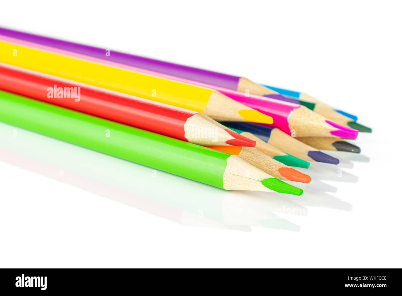 Lot of whole colored pencil rainbow colors isolated on white background