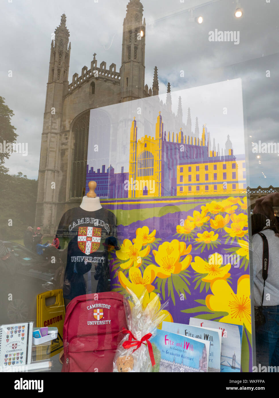 The Kings College chapel reflecting in the window of the Kings College Chapel shop in Kings Parade Cambridge UK which sells tourist souvenirs Stock Photo