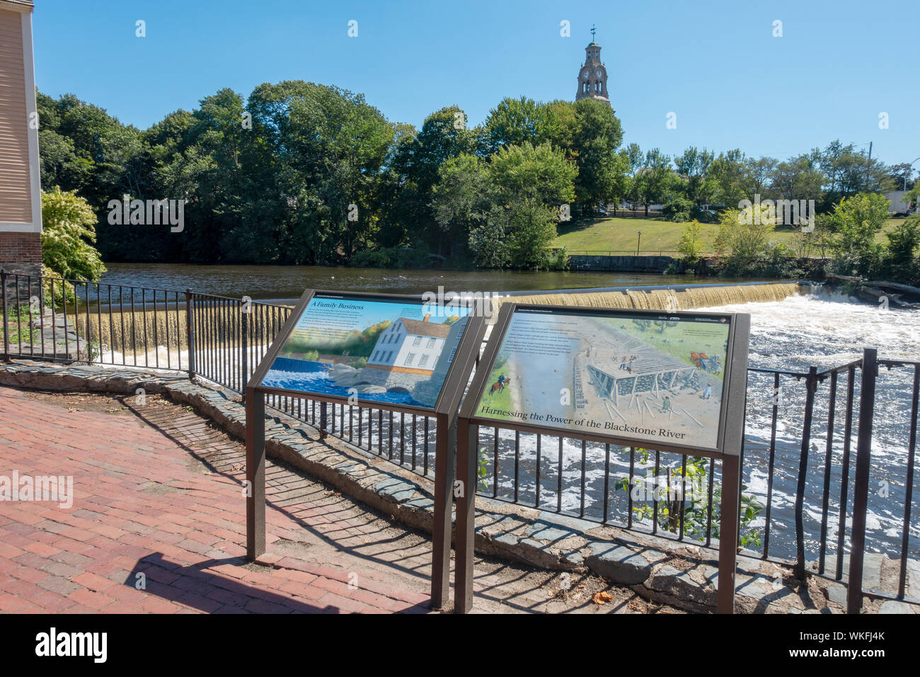 The dam at Slater Mill Historic Site with interprative signs in