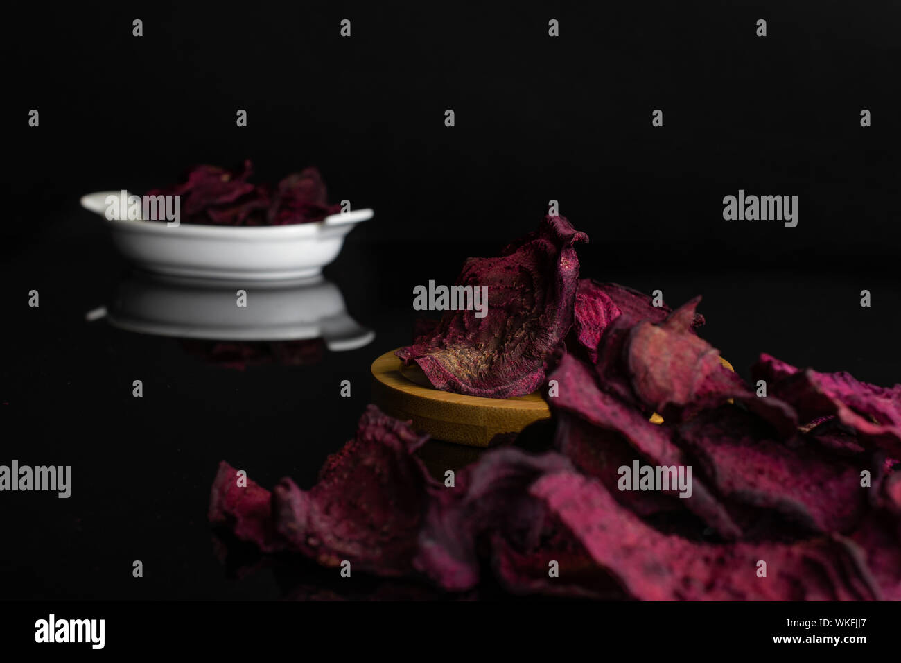 Lot Of Slices Of Dried Red Beetroot In White Oval Ceramic Bowl On