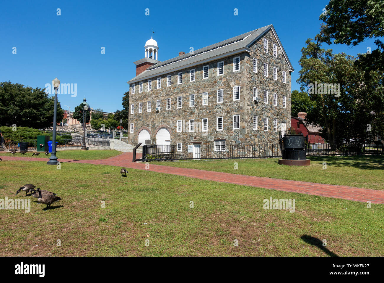 The Wilkinson Mill built in 1810 at the Slater Mill Historic Site textile museum complex on the Blackstone River in Pawtucket Rhode Island USA Stock Photo