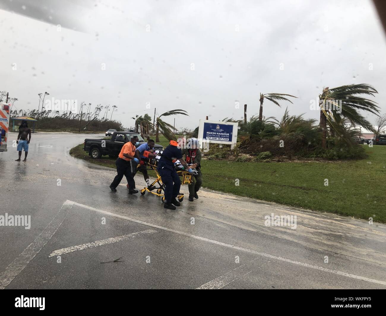 Coast Guard personnel help medevac a patient in the Bahamas during Hurricane Dorian, September 3, 2019. The Coast Guard is supporting the Bahamian National Emergency Management Agency and the Royal Bahamian Defense Force with hurricane response efforts. (Coast Guard Photo). () Stock Photo