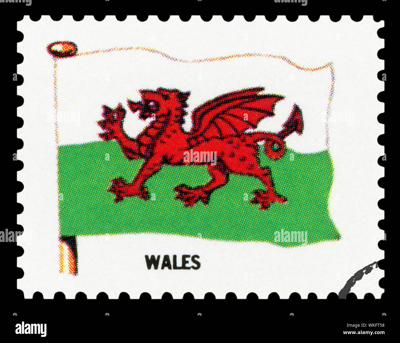 WALES FLAG - Postage Stamp isolated on black background. Stock Photo