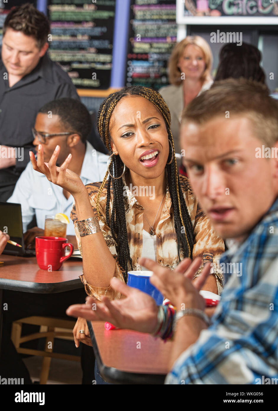 Mixed Black and white couple arguing in a cafe Stock Photo