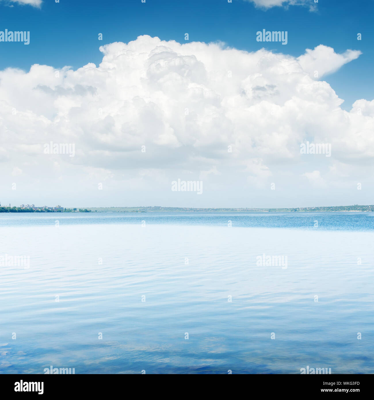 white clouds over blue water Stock Photo - Alamy
