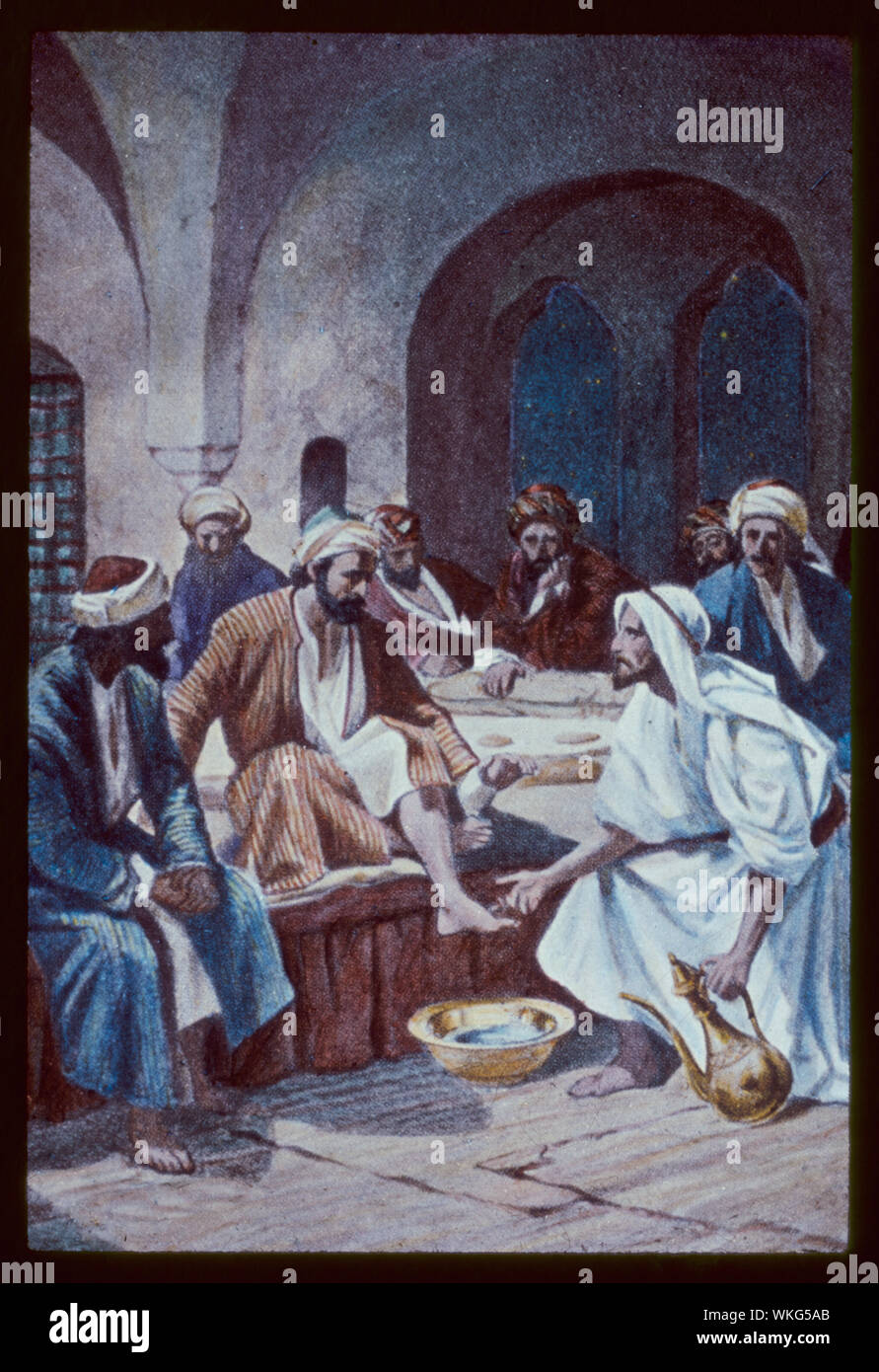 John 13:1-10. Jesus, with the twelve, partaketh of the passover feast in an upper chamber. He teacheth humility by washing the disciples' feet Stock Photo