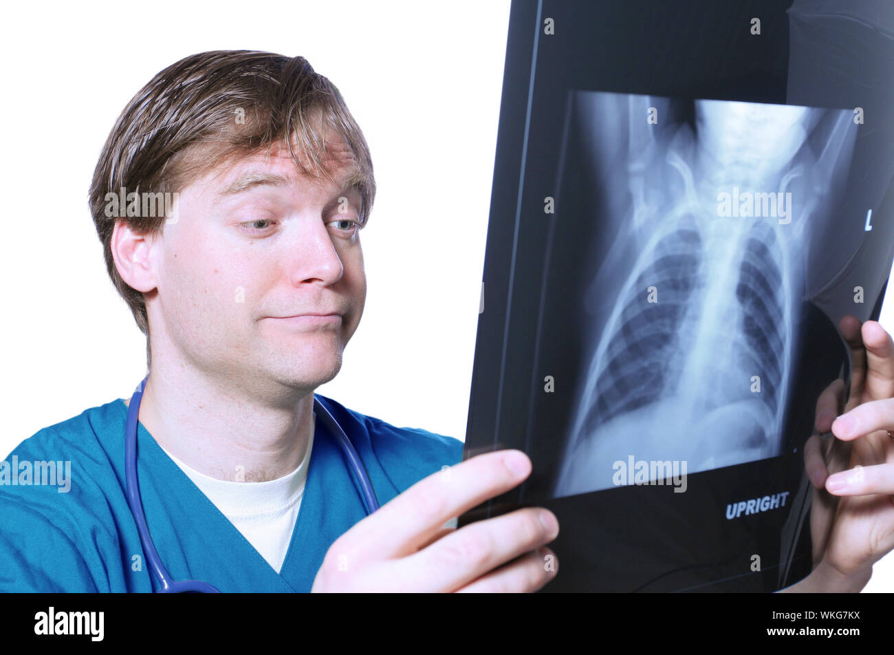 Doctor looking at xray with comical expression Stock Photo