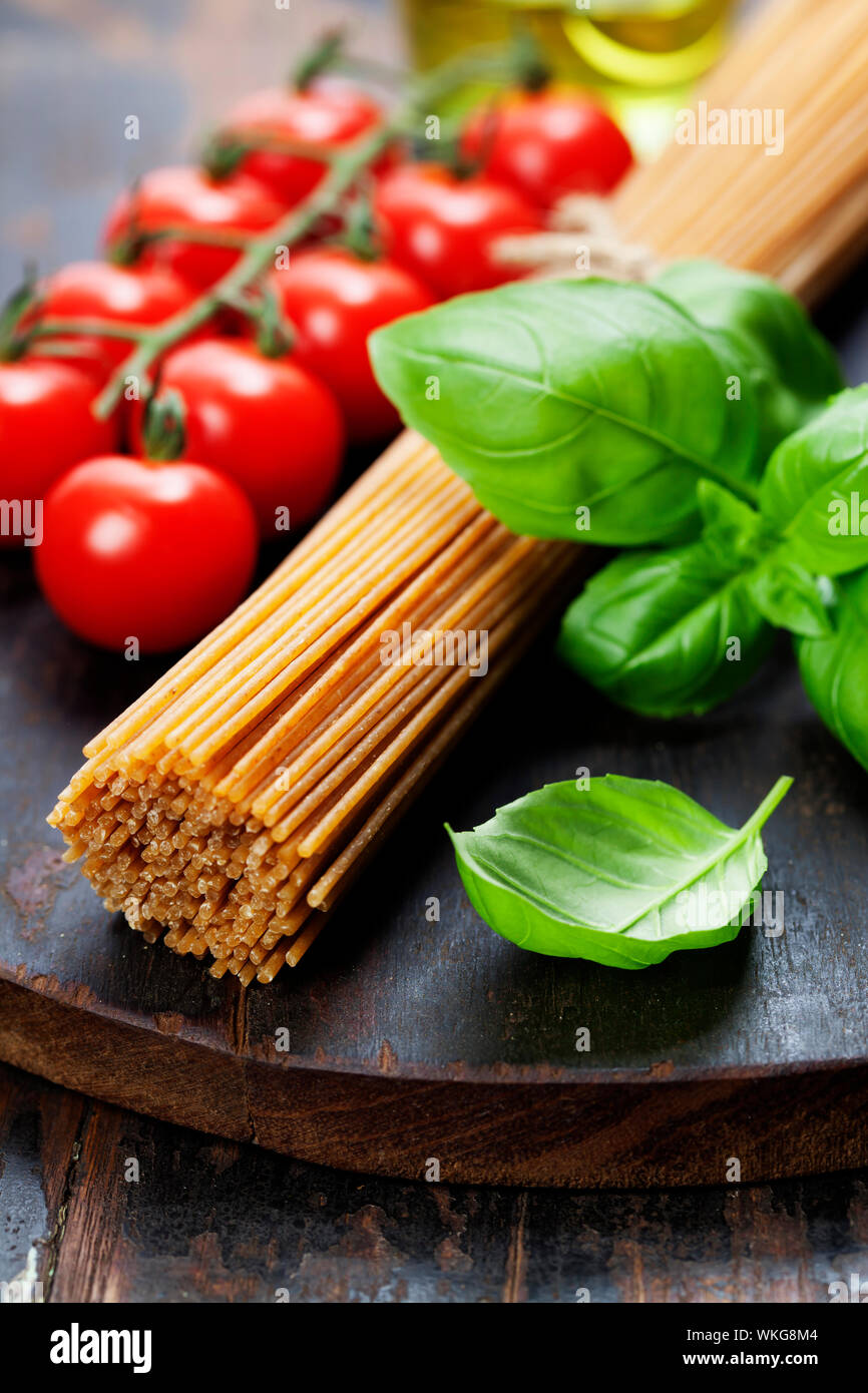 Spaghetti, basil and tomatoes Stock Photo
