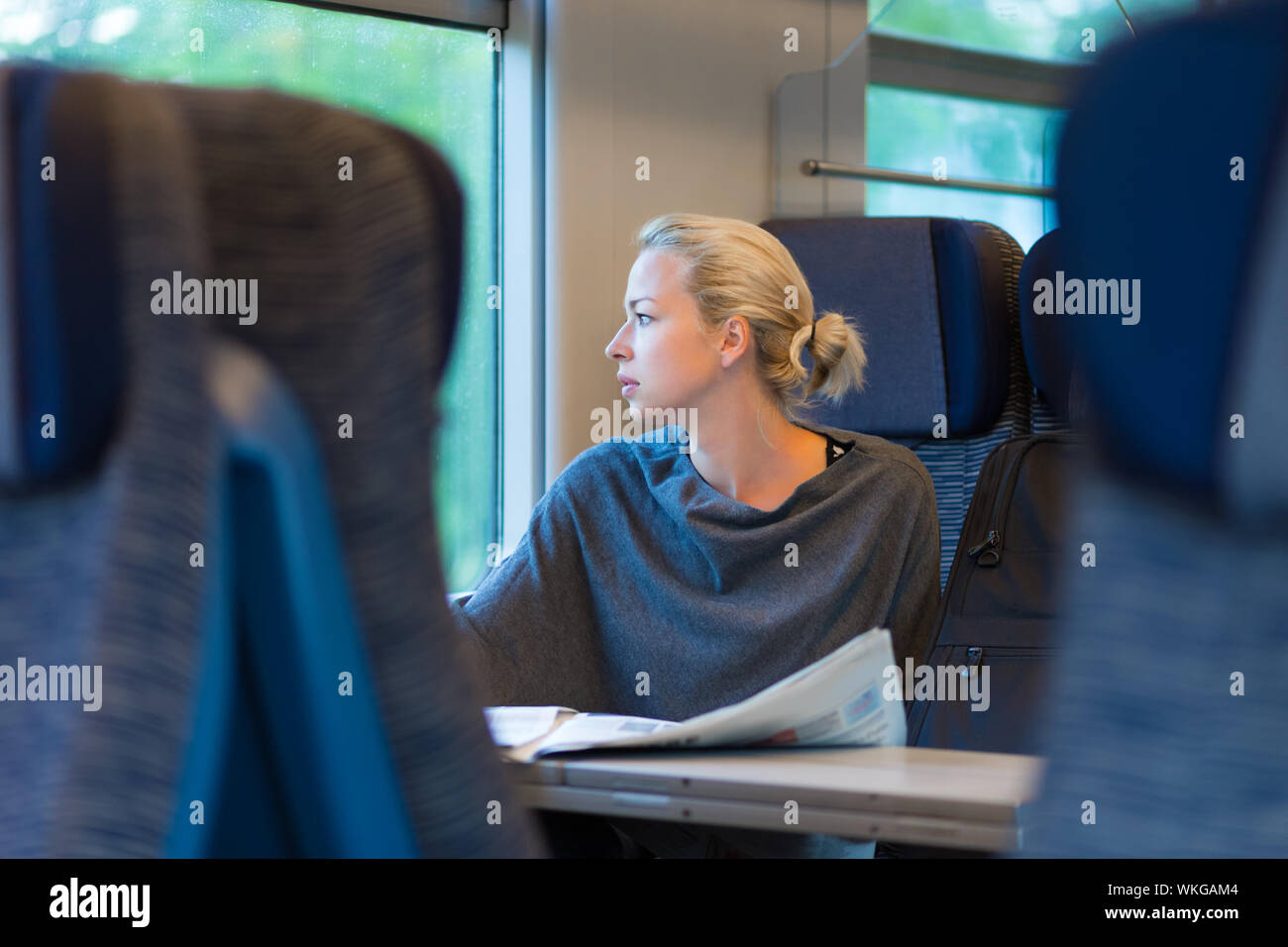 Lady traveling by train. Stock Photo