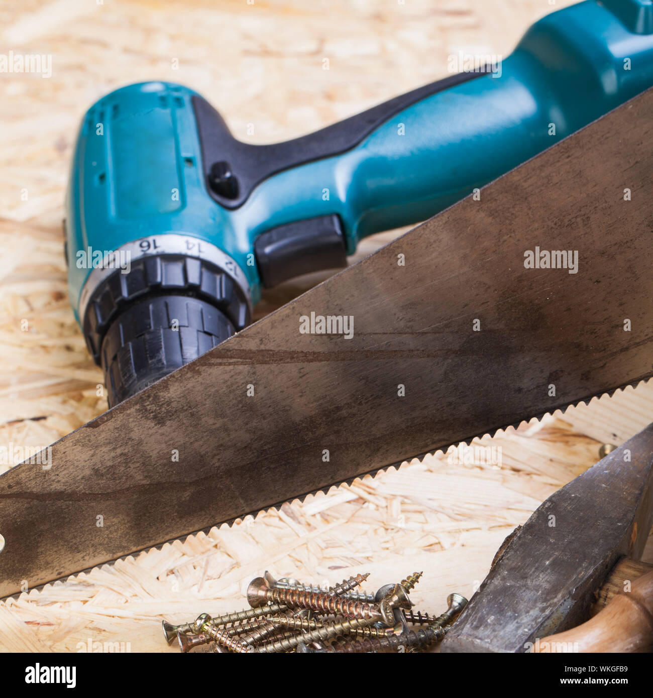 https://c8.alamy.com/comp/WKGFB9/battery-operated-portable-hand-drill-with-timber-screwdrivers-and-screws-surrounded-by-fresh-wood-shavings-in-a-carpentry-joinery-diy-or-constructi-WKGFB9.jpg