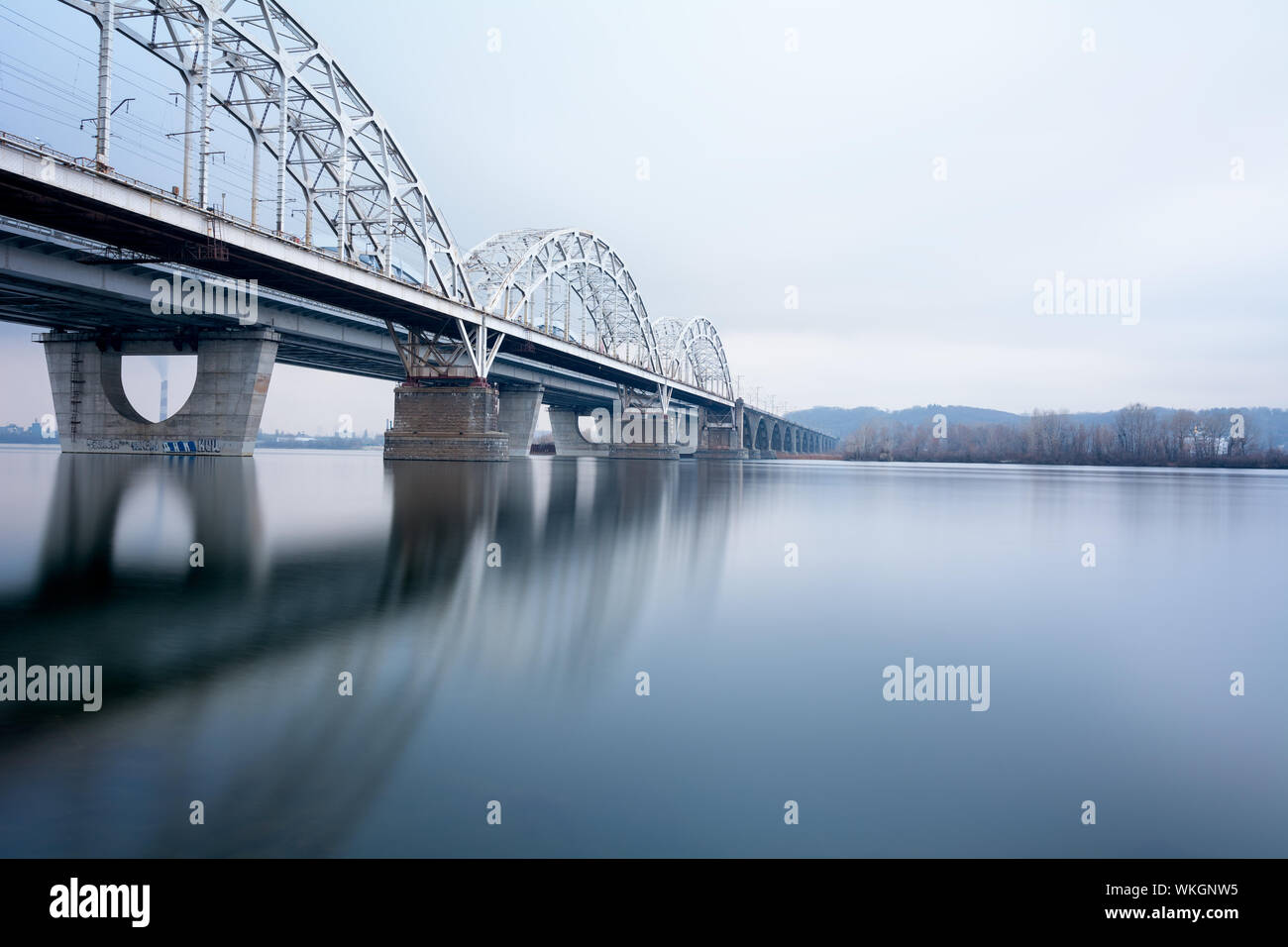 Railway Bridge Over River With Reflection Stock Photo