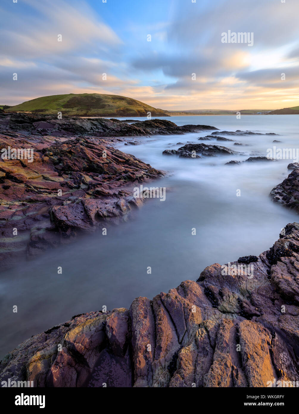 Long Exposure of the view From Daymer to Brae Hill at sunset. The Clouds moving to the horizon Stock Photo