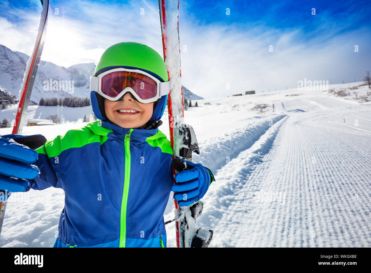 Close smiling portrait of a boy with ski on slope Stock Photo - Alamy