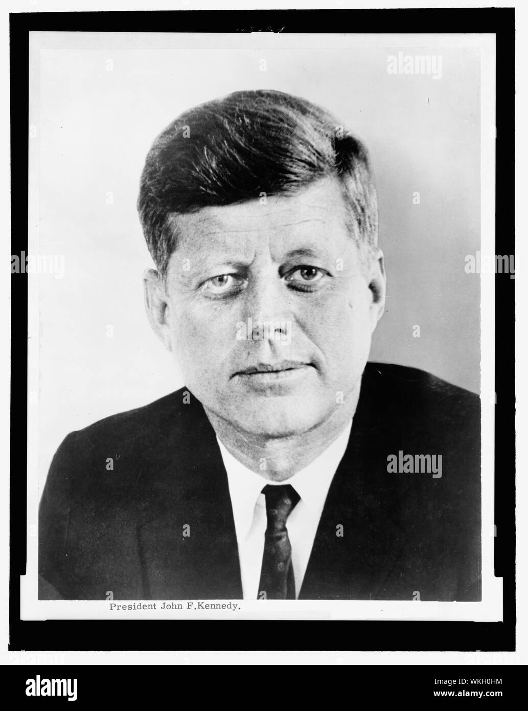 John F. Kennedy - 35th President of the United States from 1961 until his assassination in 1963. Head-and-shoulders portrait, facing front. Photographic print. Stock Photo