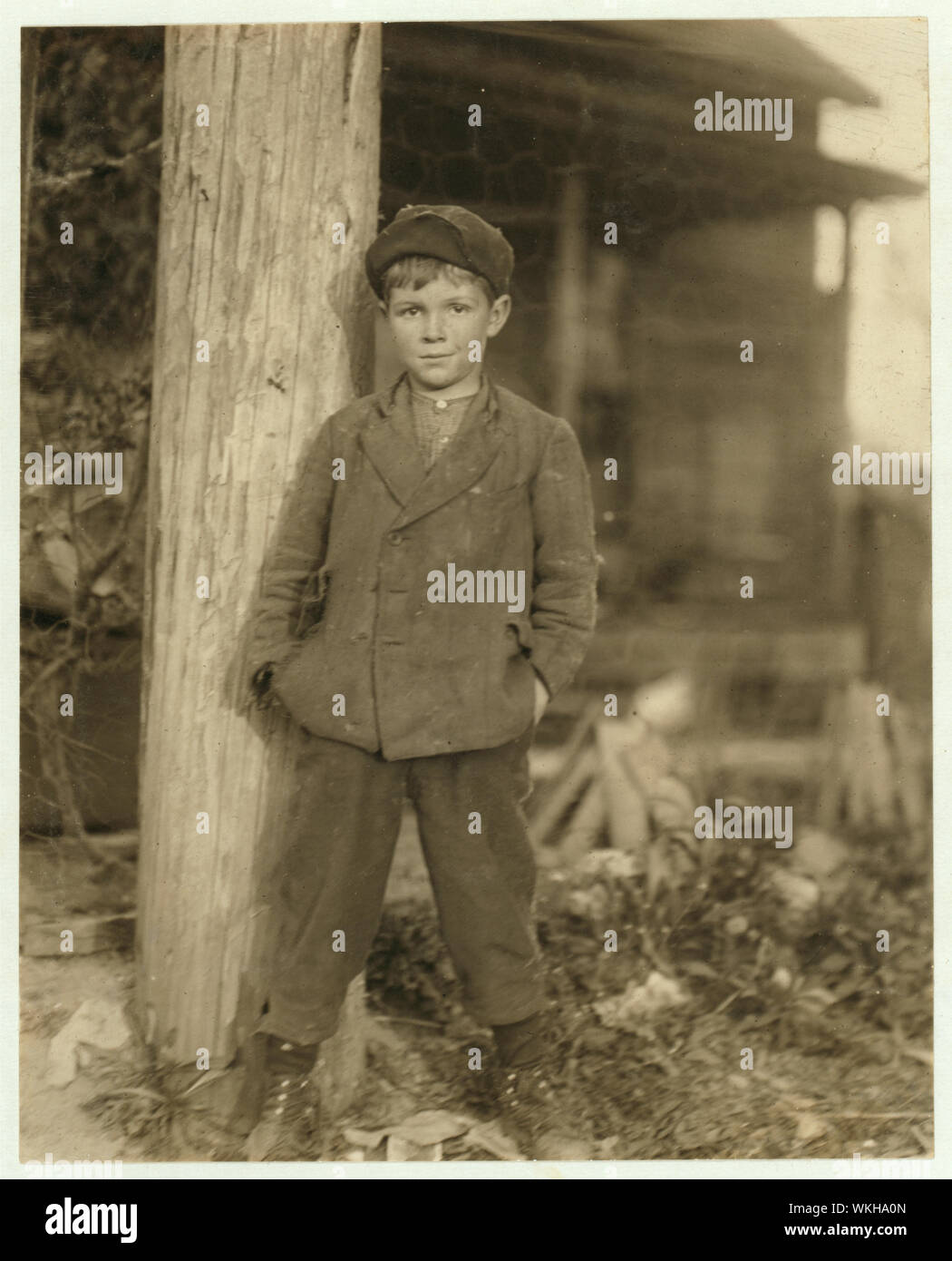 John Holland. Said he was 10 years old. Has had a regular job for some months rolling bobbins in the Deep River Mill. Been helping the father and brother a year. Abstract: Photographs from the records of the National Child Labor Committee (U.S.) Stock Photo