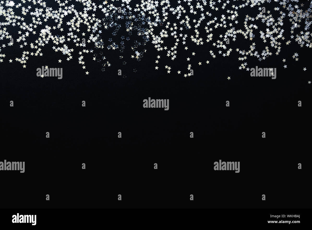 Star shaped silver sequins background. Copy space. Stock Photo
