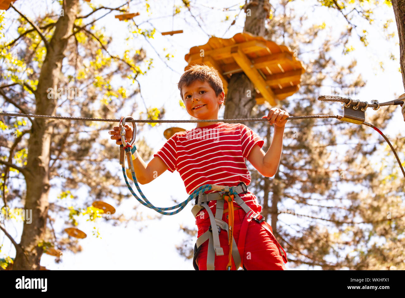 Portrait of the boy at rope park walking Stock Photo - Alamy
