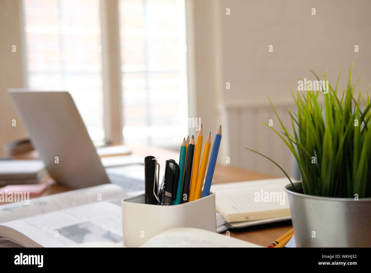 book pen pencil computer on library desk. back to school learning