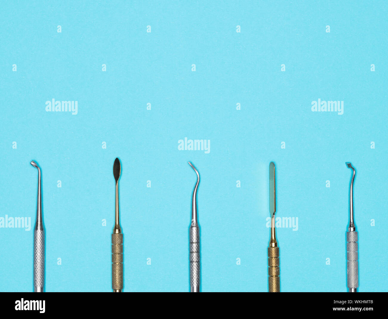 Dental instrument on blue background with copy space. Dental care concept Stock Photo