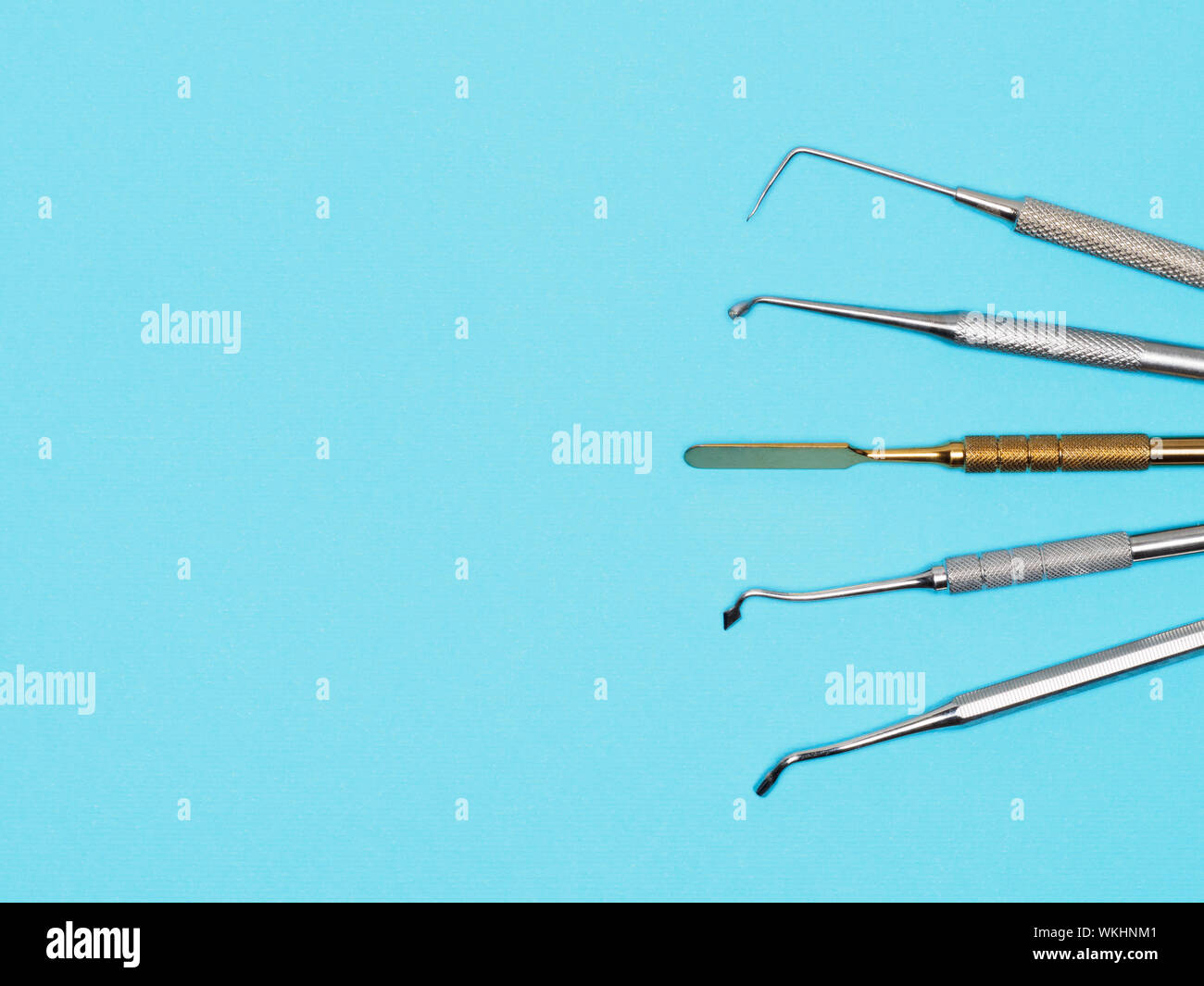 Dental tools on blue background with copy space. Dental care concept Stock Photo