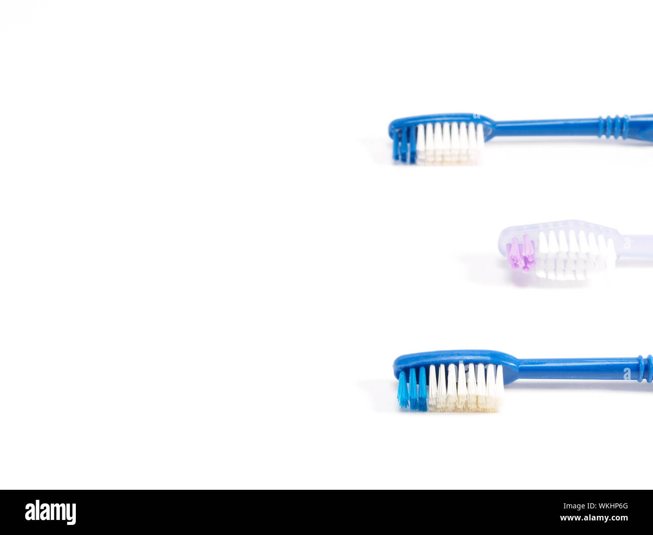Toothbrushes on white background. Dental care concept Stock Photo - Alamy