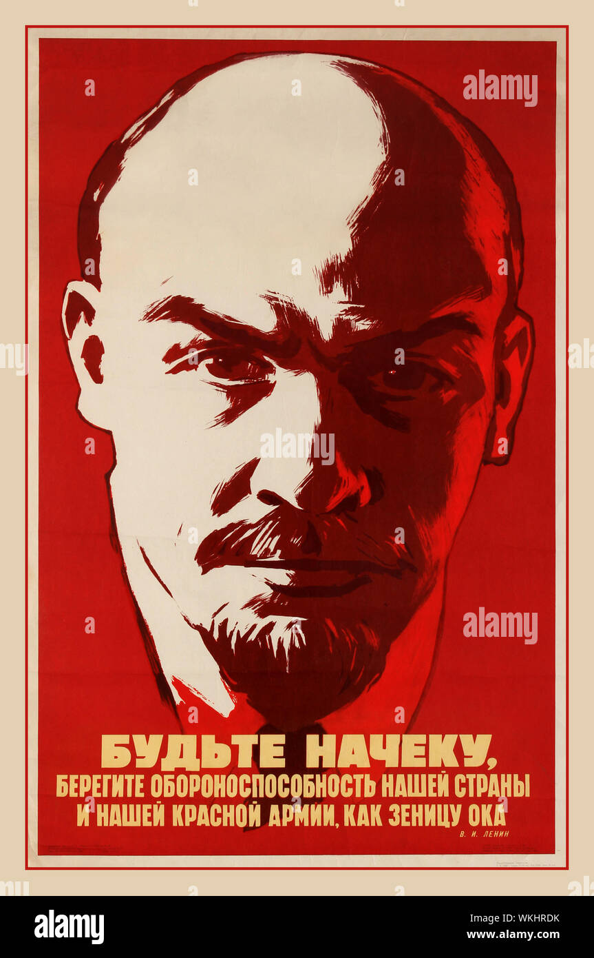 Soviet Propaganda poster featuring a striking portrait of Lenin set against a red background with the quote from Lenin positioned at the bottom reading: Be on the Alert! Protect the combat readiness of our country and Red Army like an apple of your eye. Russia, :1968, designer: K. Ivanov, Stock Photo