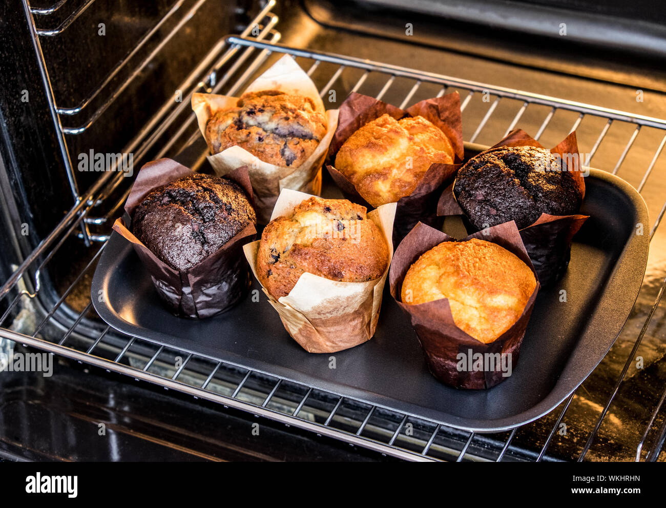 Baking muffins in the oven. Cooking in the oven Stock Photo - Alamy