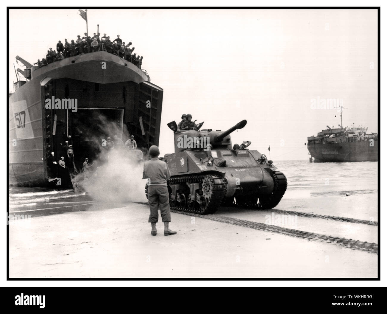 NORMANDY WW2 INVASION 1944 LST-517 amphibious (landing ship tank) offloading a Sherman tank of the French 2nd Armored Division, August 1944 During World War II, LST-517 was assigned to the European theater and participated in the invasion of Normandy on 6 June 1944 Second World War Stock Photo