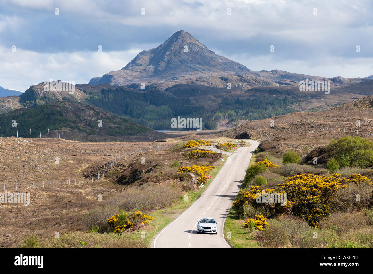 Car driving on the North Coast 500 tourist motoring route near laxford bridge in northern Scotland, UK Stock Photo