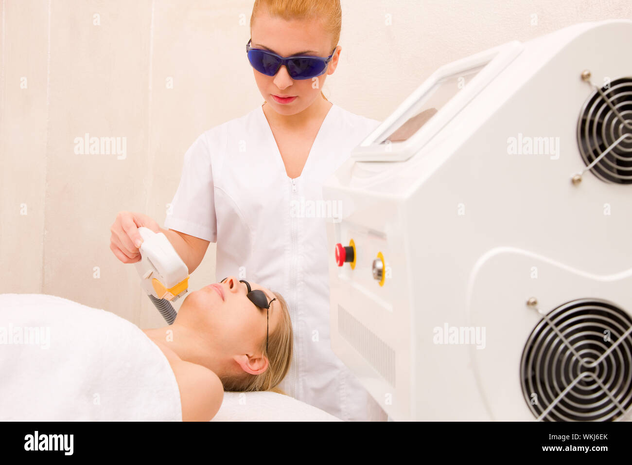 Woman getting ultrasound hair removal treatment Stock Photo