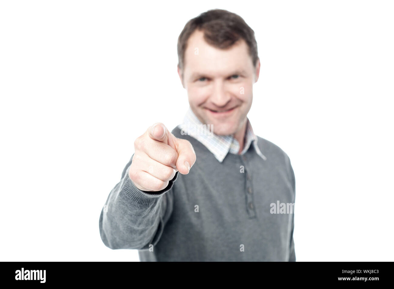 Happy middle aged man pointing at camera Stock Photo