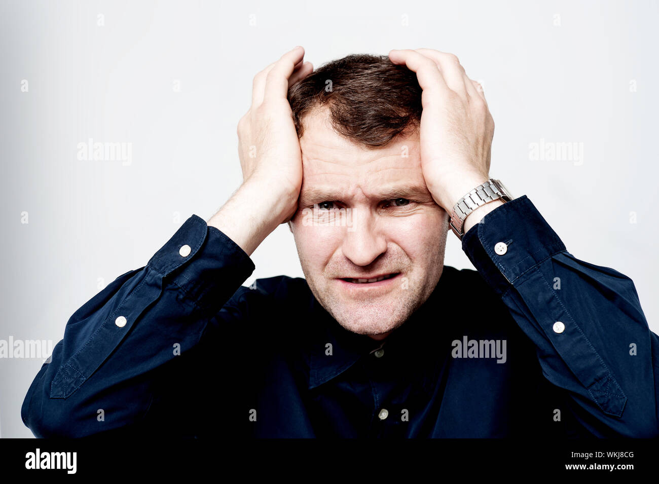 Business executive suffering from headache Stock Photo