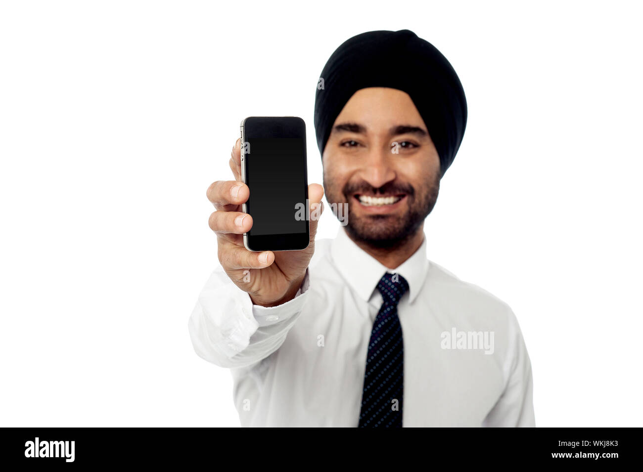 Sales representative displaying newly launched mobile phone Stock Photo