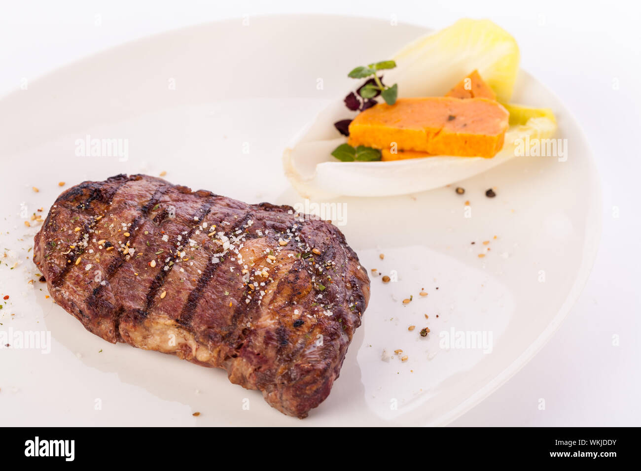 Grilled beef steak with seasoning Stock Photo - Alamy