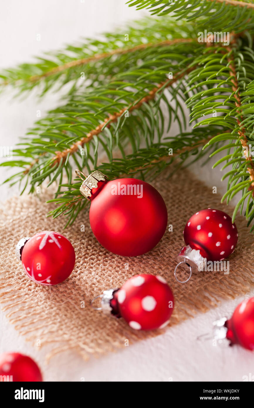 Pretty red polka dot Christmas bauble in a rustic Xmas seasonal ...