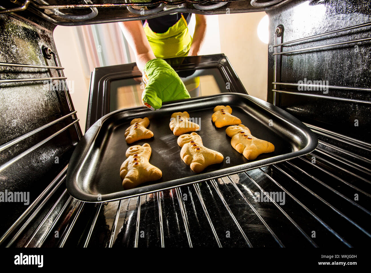 Baking Gingerbread man in the oven, view from the inside of the oven ...