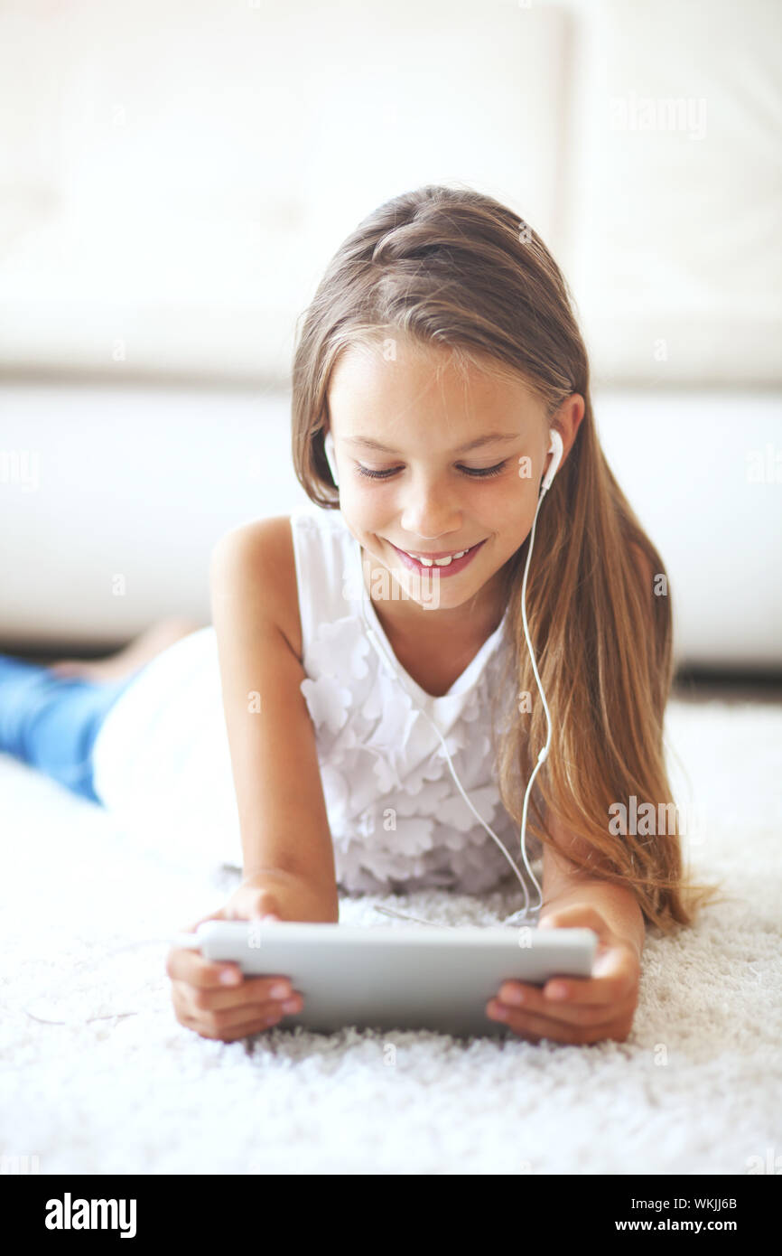 Teen girl laying on sofa hi-res stock photography and images - Alamy