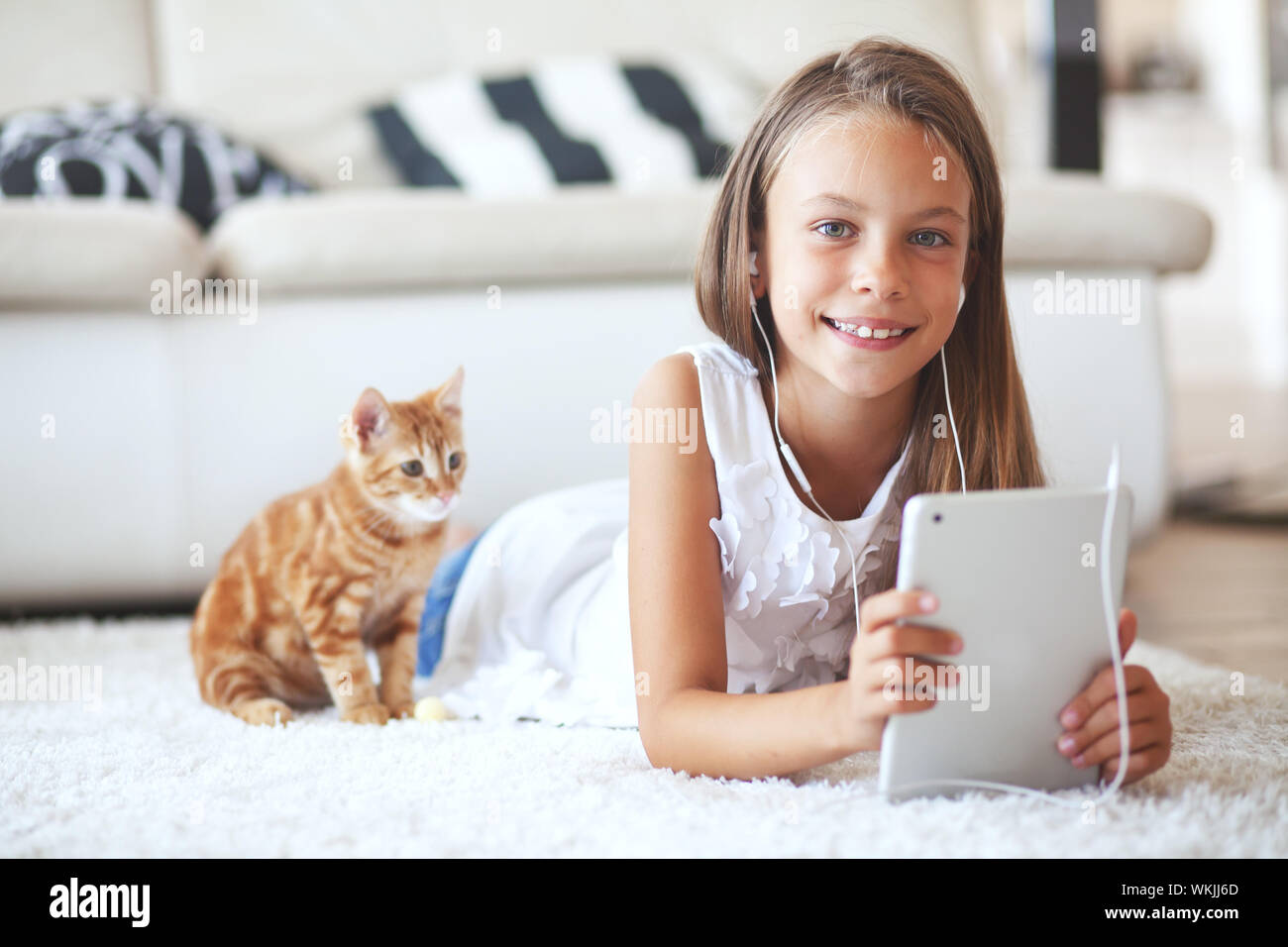Teen girl laying on sofa hi-res stock photography and images - Alamy