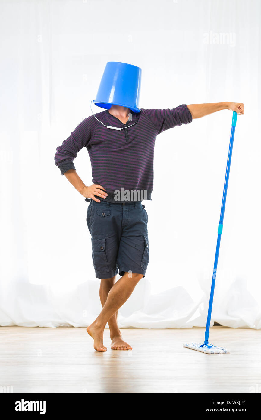 Young man mopping the floor. Or is he? Stock Photo