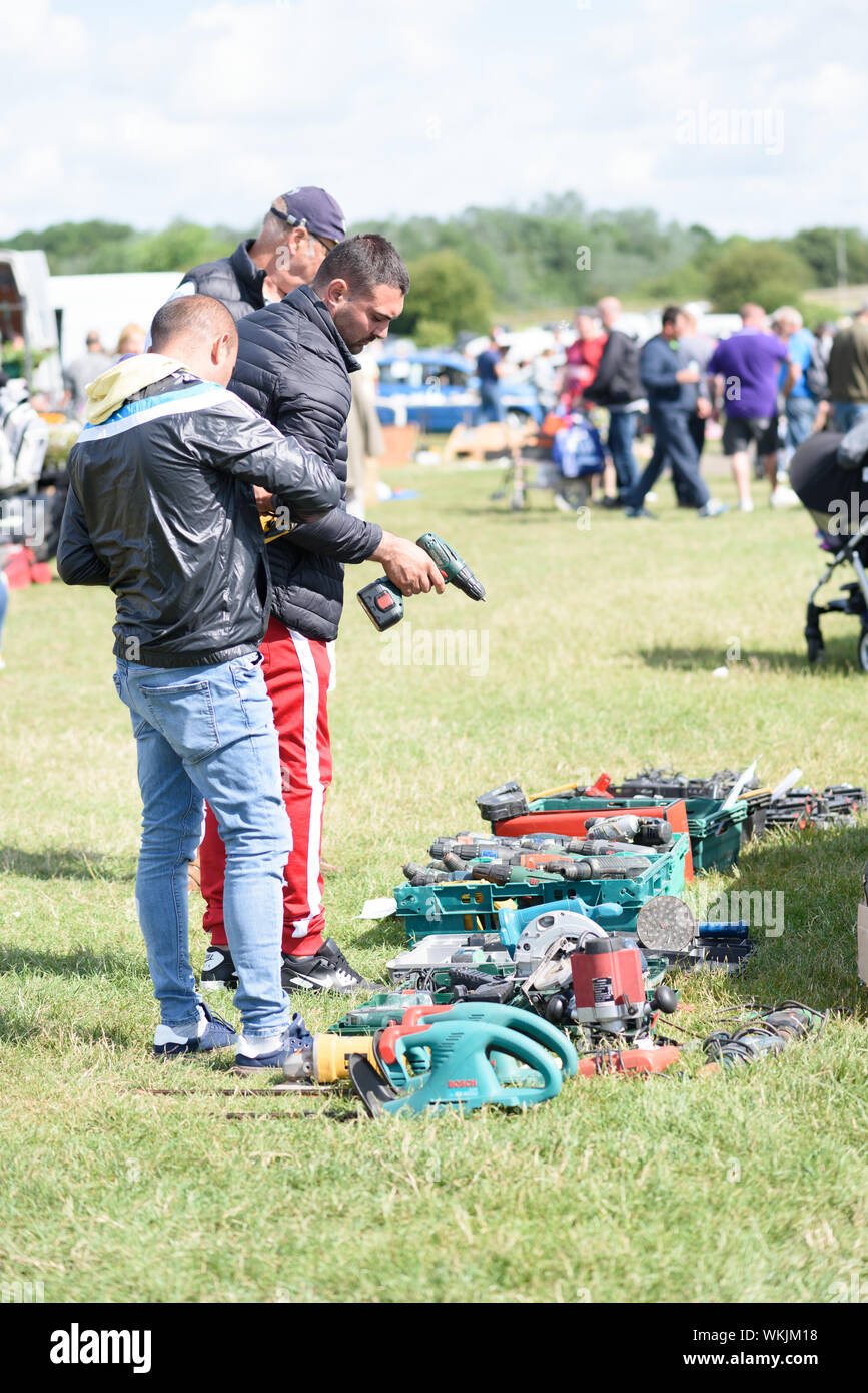 CHELMSFORD, ESSEX/ENGLAND - 1ST JUNE 2019 - Men visiting a car boot sale in  Boreham Essex where they are looking at drills and tools for work and can  Stock Photo - Alamy