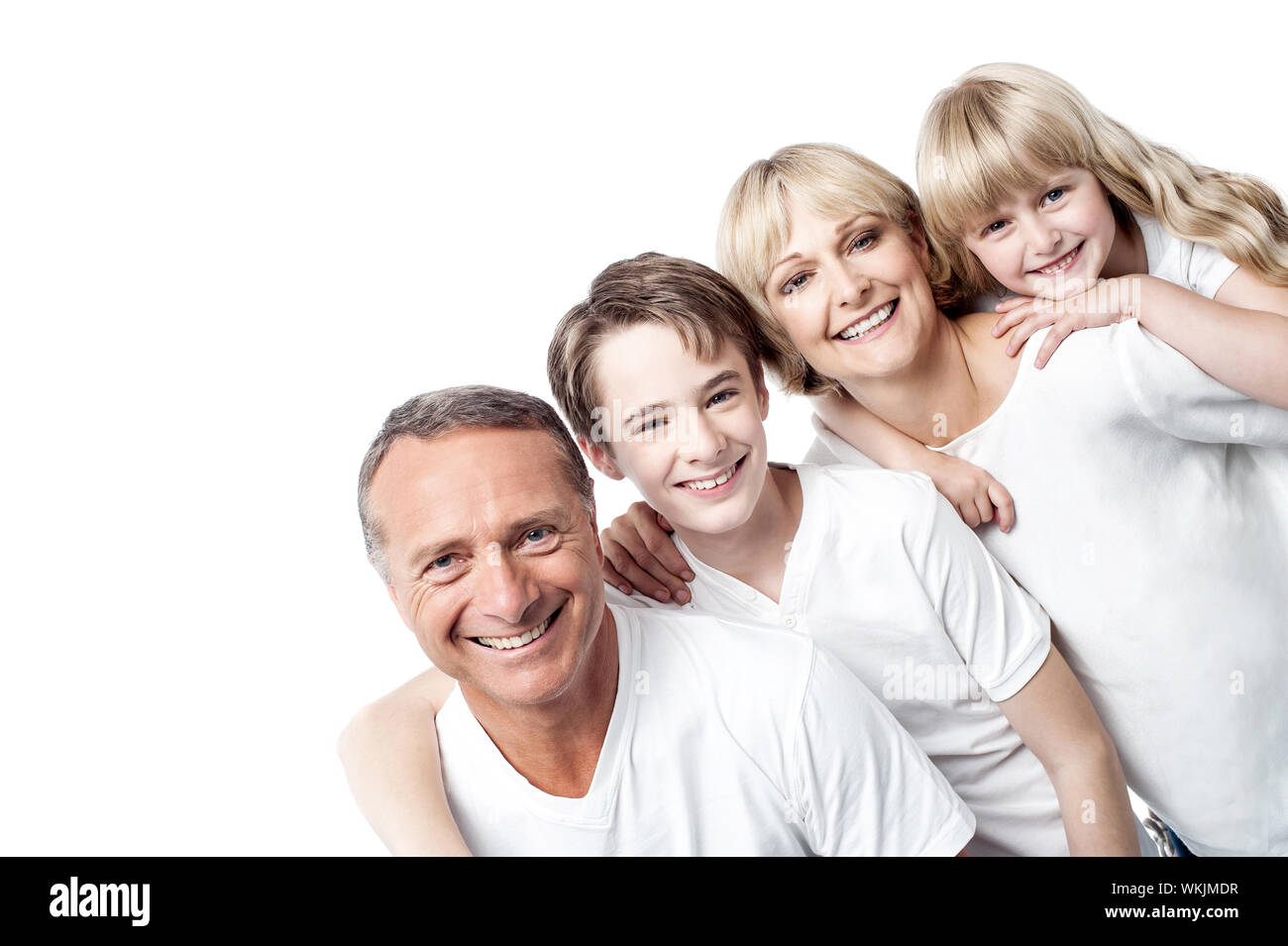 Family standing together with hands on shoulder Stock Photo