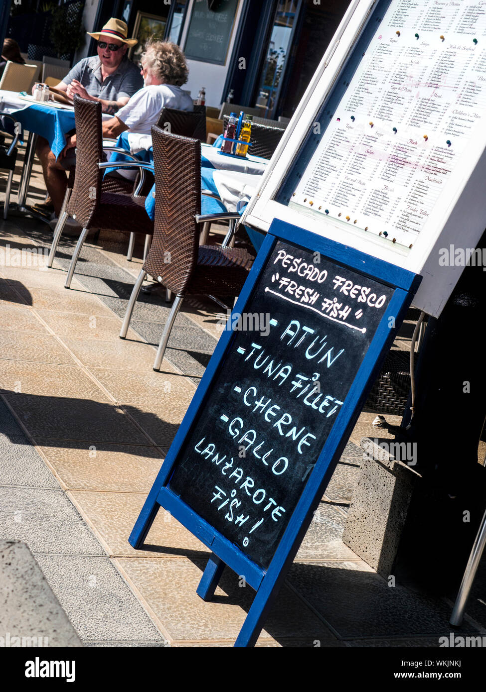 MENU BLACKBOARD FISH Lanzarote restaurant menu blackboard outside Puerto Calero alfresco bar cafe restaurant specialising in Lanzarote fish.. ATUN,TUNA FILLET, CHERNE,GALLO. Stock Photo