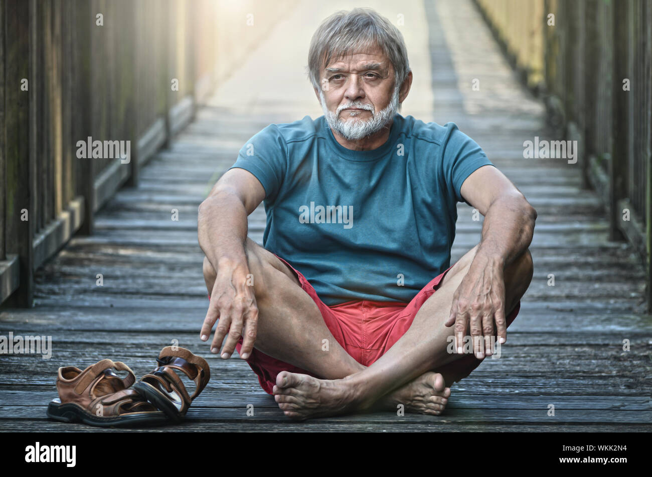 Old man balanced and satisfied Stock Photo