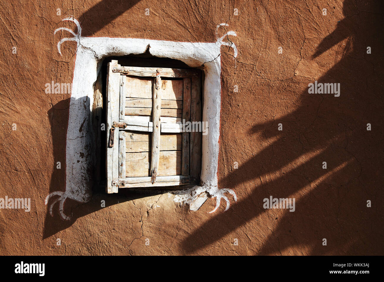 Closed Wooden Window Of Old Mud Hut Stock Photo