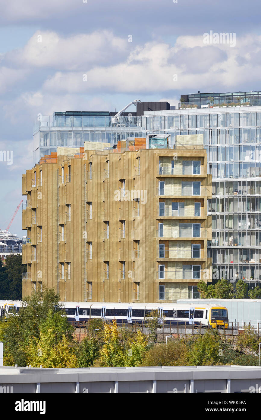 High level view of Faraday House with railroad tracks and context