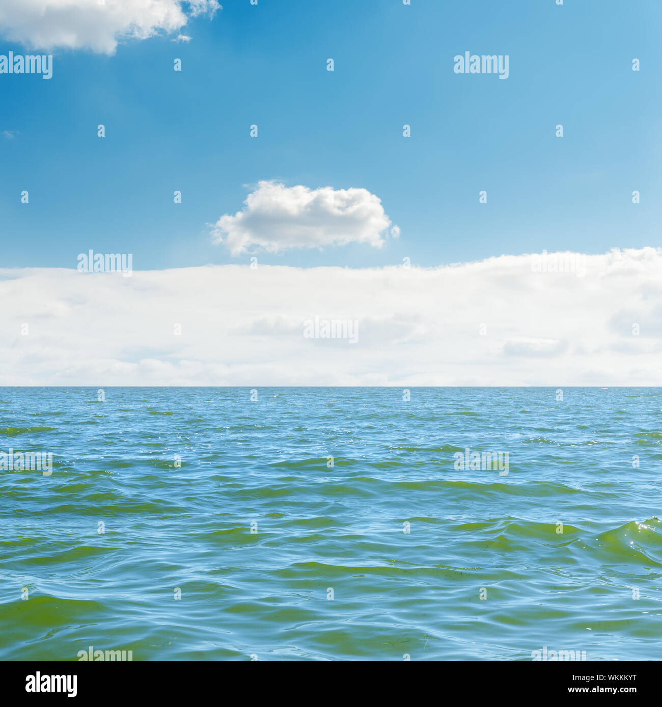 blue sea, sky and white clouds over it Stock Photo - Alamy