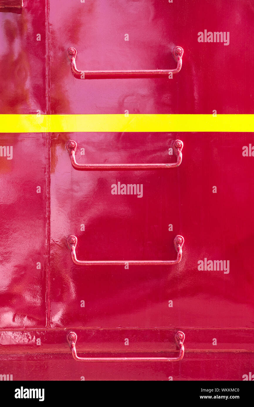 Metal ladder rungs on the side of red train caboose Stock Photo Alamy