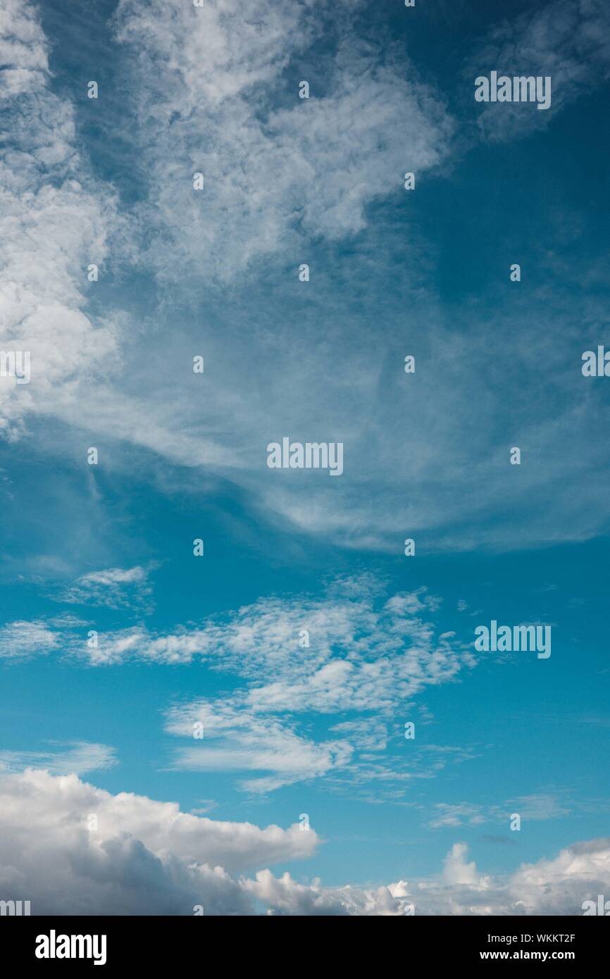 Teal Blue Sky With Clouds Stock Photo